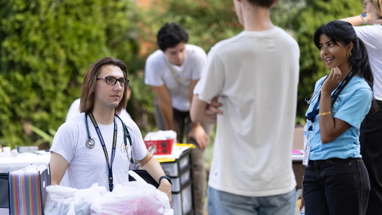 a male medical student speaks to a patient