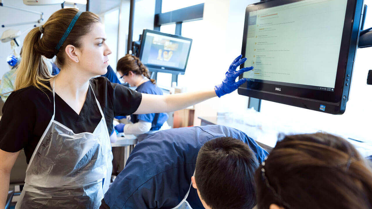 Students in the Frank H. Netter MD School of Medicine work in the Anatomy Lab.